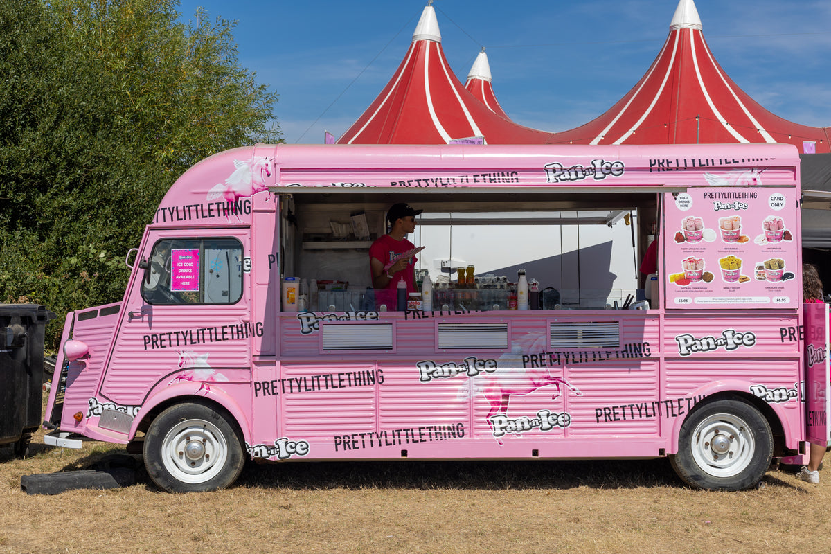 Team member inside a pink PrettyLittleThing and Pan-n-Ice Citroen HY ice cream truck at an outdoor event