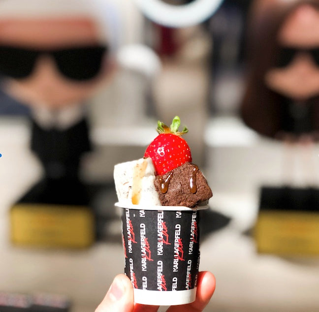 Ice cream rolls served in a branded black cup