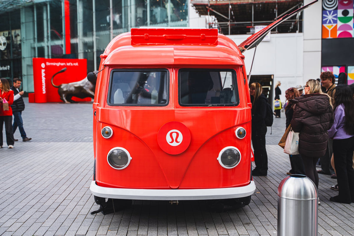 Red lululemon-branded VW coffee truck at a Birmingham campaign