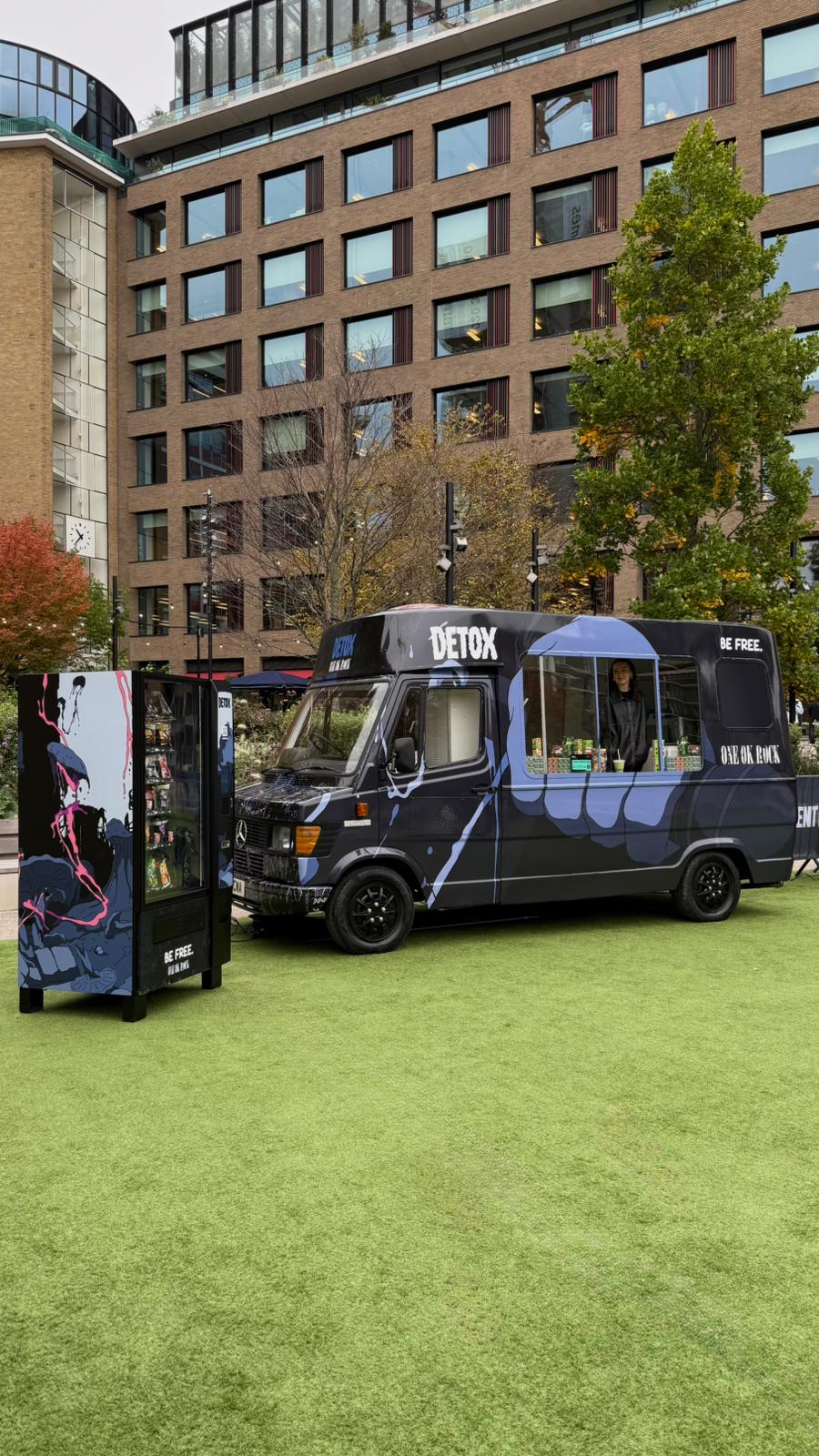 Classic Mercedes truck wrapped for ONE OK ROCK with a separate branded vending-machine installation